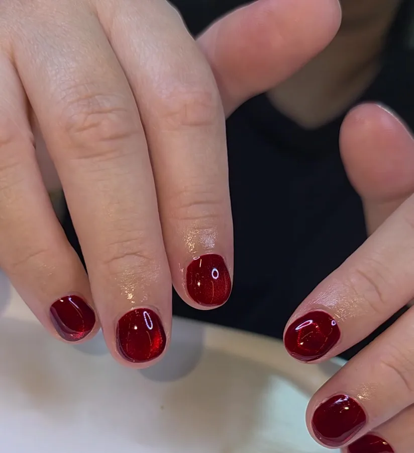 Short glossy cherry red gel nails with neat cuticles, Nanny Nails Nakhon Phanom