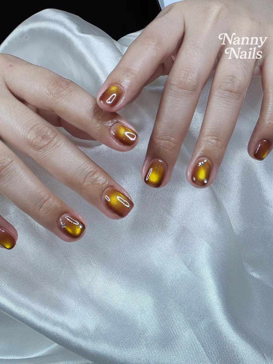 Amber gold cat eye gel nails, Nanny Nails, nail salon in Nakhon Phanom