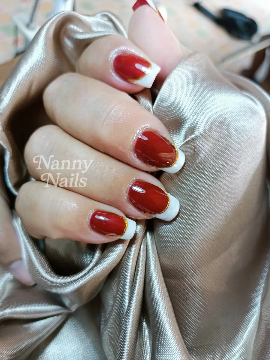 Red gel nails with white French tips, sealed at the free edge, Nanny Nails, nail salon in Nakhon Phanom