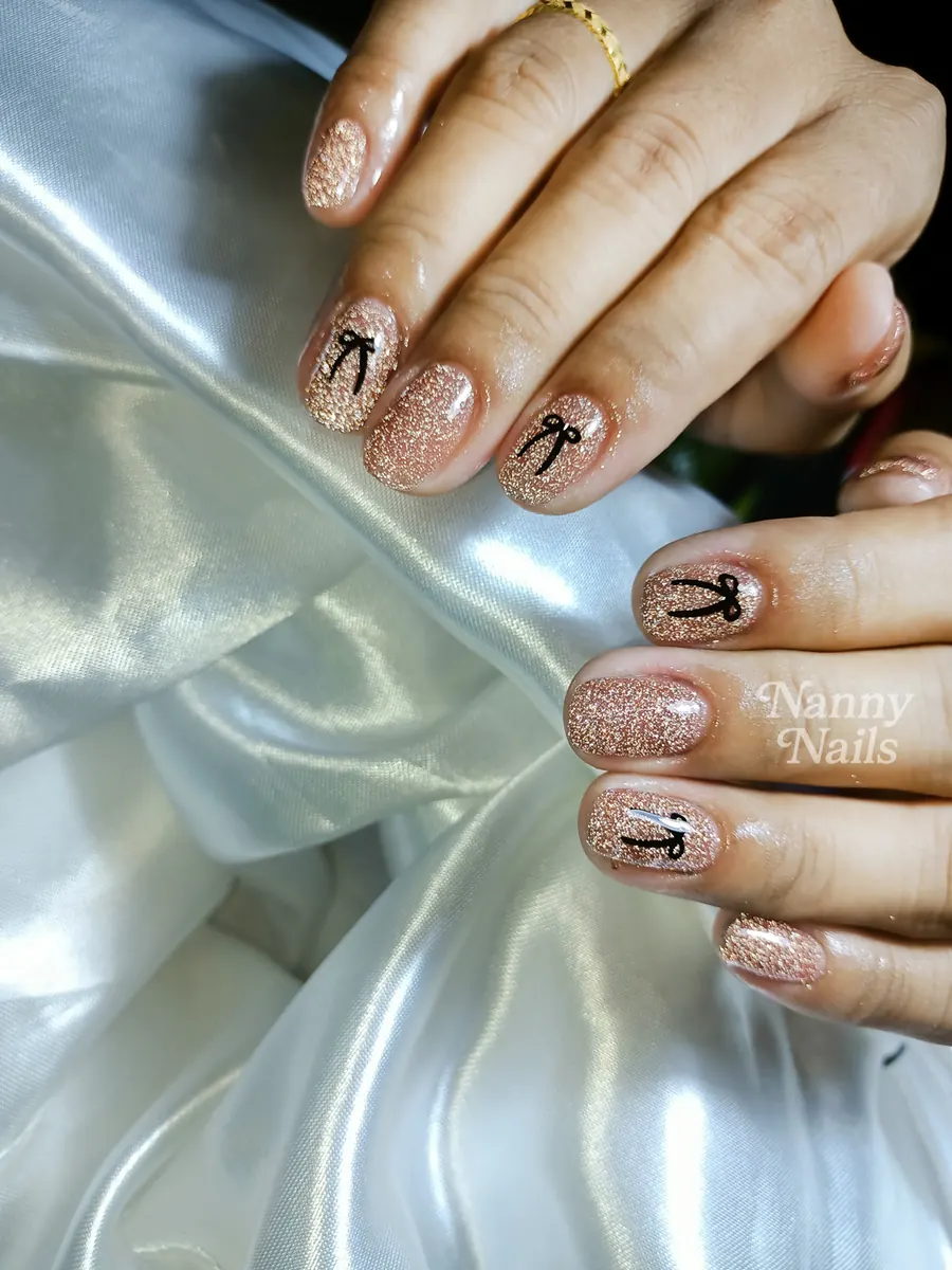 Rose gold flash glitter nails that sparkle under a camera flash, Nanny Nails, nail salon in Nakhon Phanom