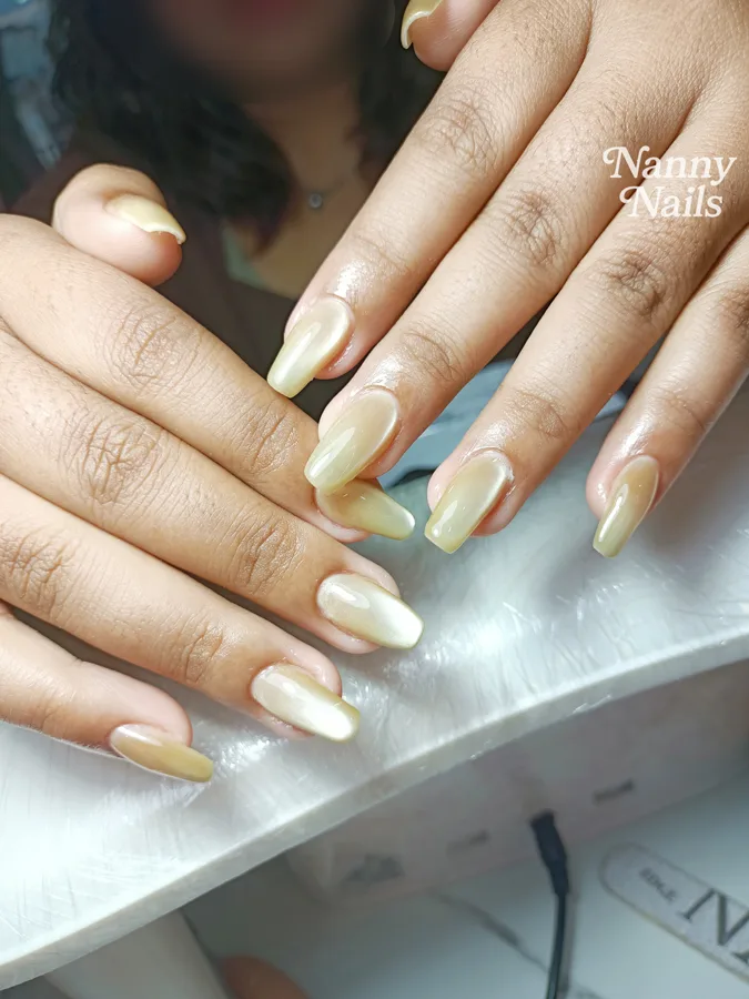Pearly cream nails to match a silk Thai dress, Nanny Nails, nail salon in Nakhon Phanom
