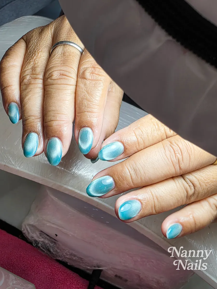 Sea blue cat eye nails, lucky colour for people born on Friday, Nanny Nails, nail salon in Nakhon Phanom