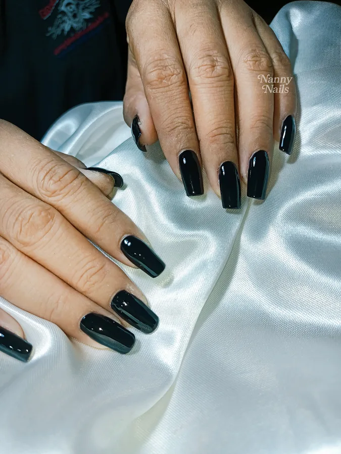 Glossy black gel on every nail, showing how black looks with a high shine, on a female customer, Nanny Nails Nakhon Phanom