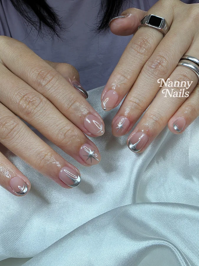 Clear gel nails with silver chrome French tips, on a female customer, Nanny Nails Nakhon Phanom