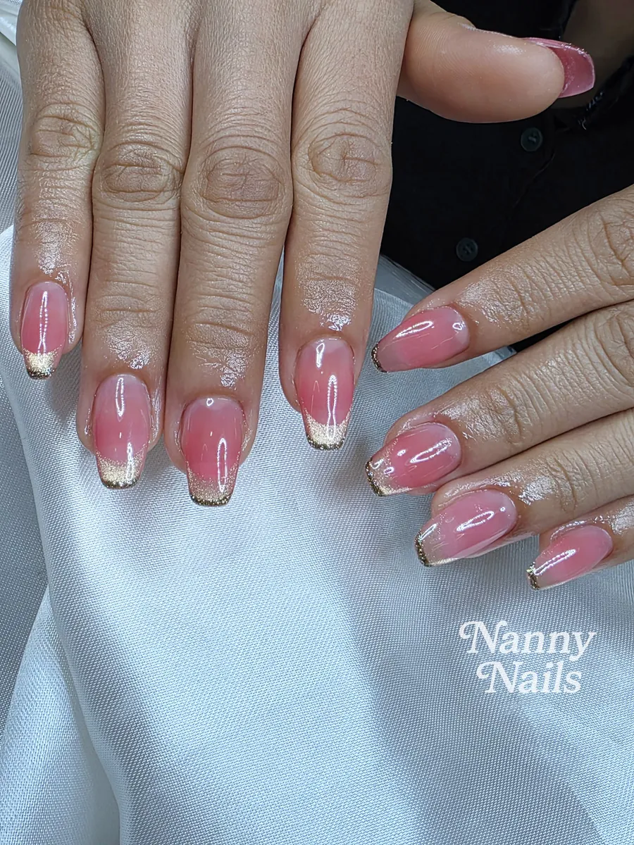 Sheer pink gel with a thin gold micro French tip, Nanny Nails, nail salon in Nakhon Phanom