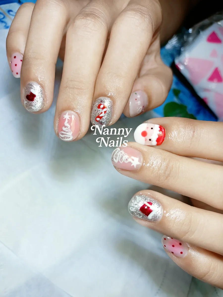 Cute Christmas nails, Santa, candy cane and stocking with silver glitter on short nails, Nanny Nails, nail salon in Nakhon Phanom