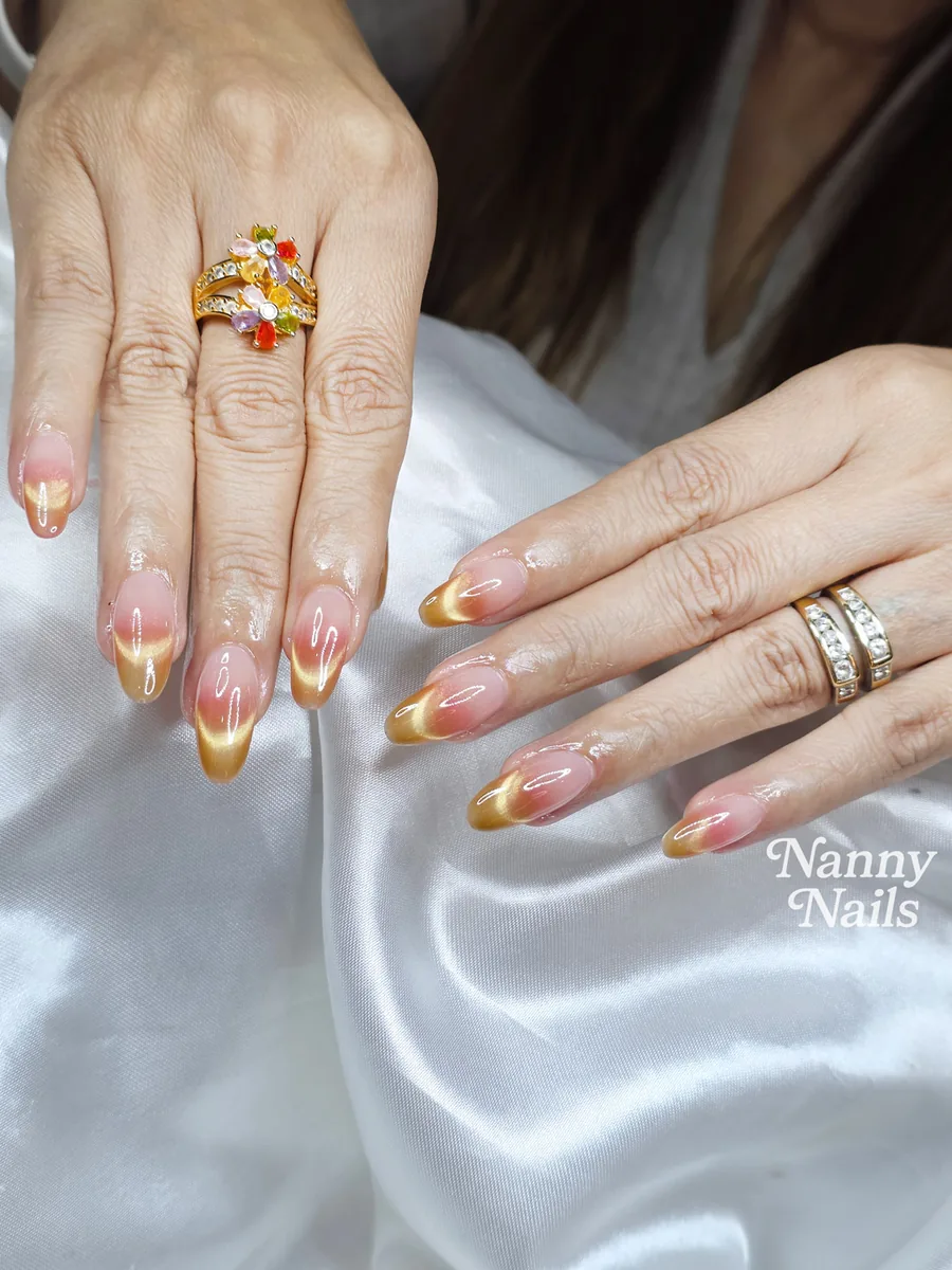 New Year 2027 nails, gold French tips on almond nails, Nanny Nails, nail salon in Nakhon Phanom