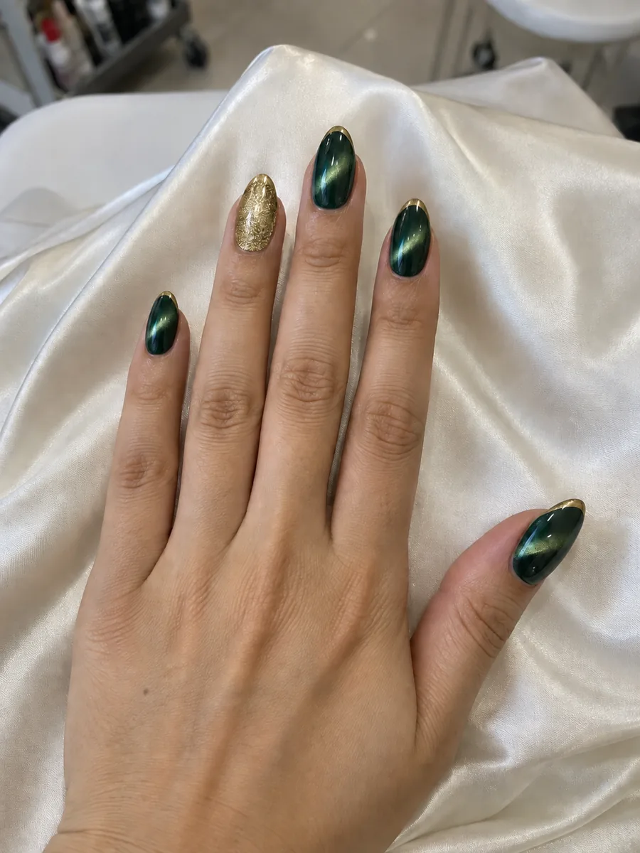 Elegant Christmas nail idea, pine green cat eye with a gold tip line, AI image, not salon work, Nanny Nails Nakhon Phanom