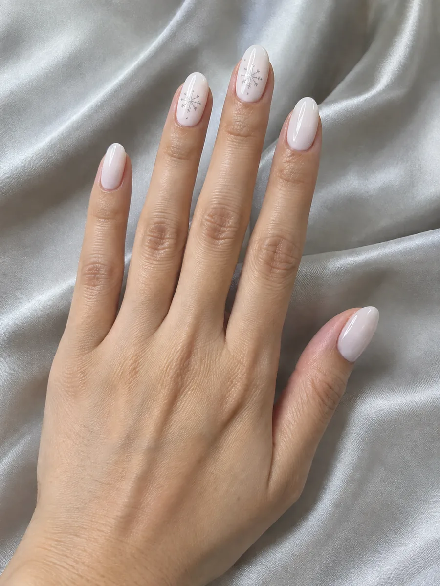 Elegant Christmas nail idea, milky white with fine silver snowflakes, AI image, not salon work, Nanny Nails Nakhon Phanom