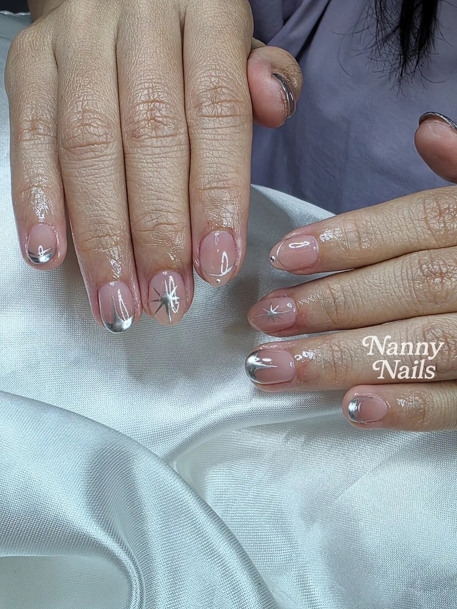 New Year nails, silver chrome French tips with sparkle stars, Nanny Nails, nail salon in Nakhon Phanom