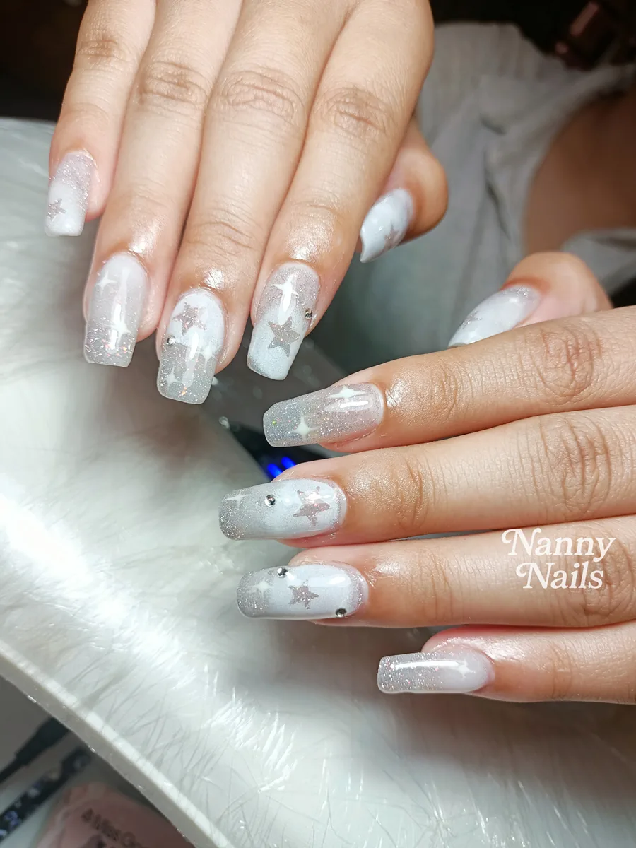 Elegant Christmas nails, snow white with silver glitter and stars, Nanny Nails, nail salon in Nakhon Phanom