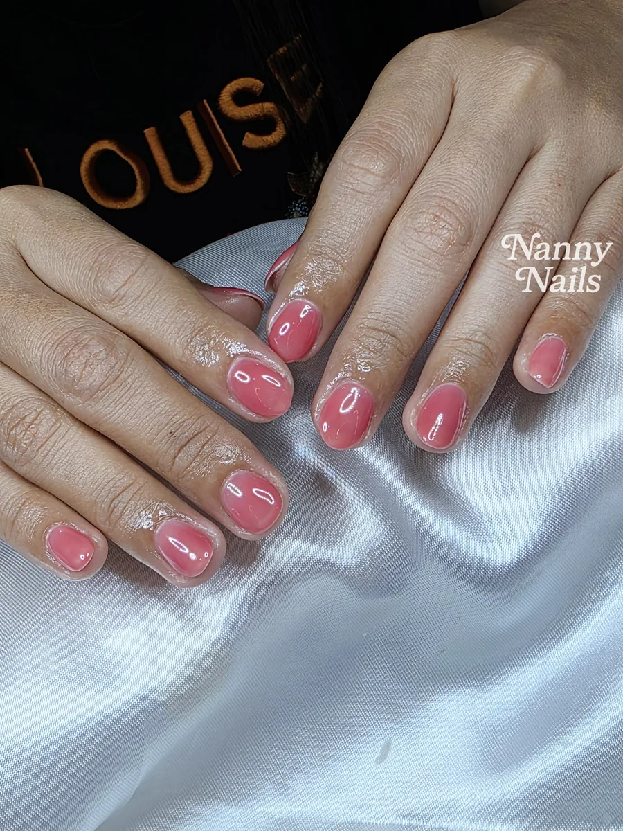 Coral pink gel nails that flatter tan skin, short nails, Nanny Nails, nail salon in Nakhon Phanom
