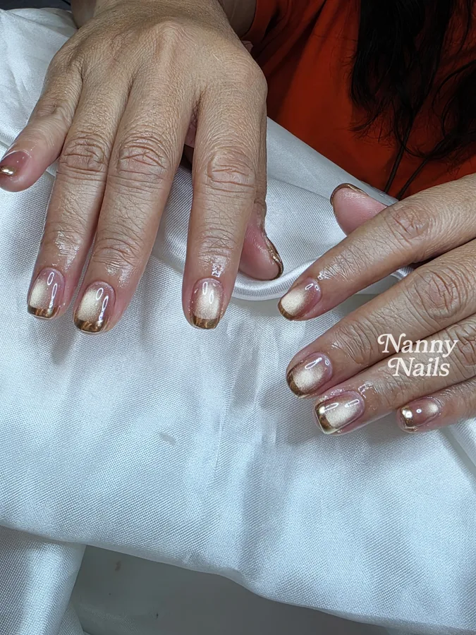 Nails for a white Thai dress: gold mirror French tips on nude, Nanny Nails, nail salon in Nakhon Phanom
